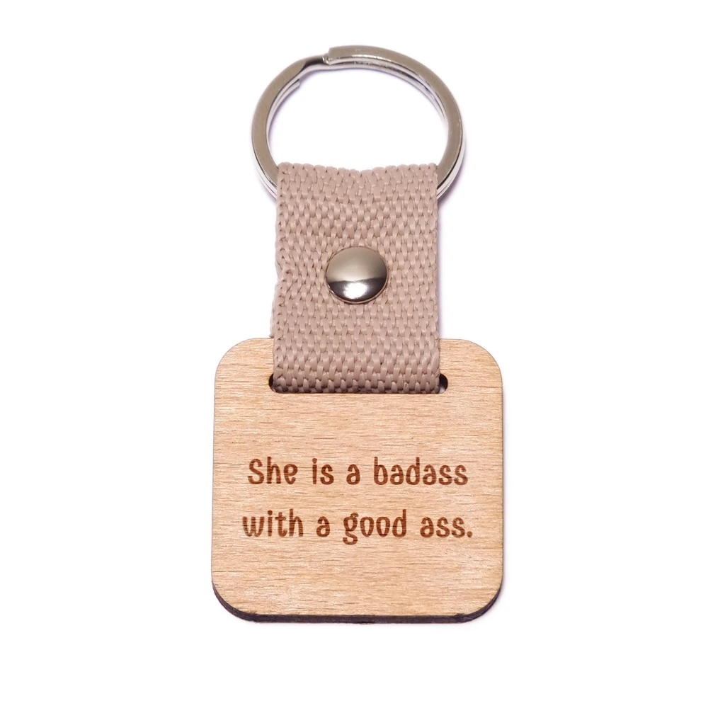 She is a badass with a good ass. fa kulcstartó She is a badass with a good ass. fa kulcstartó